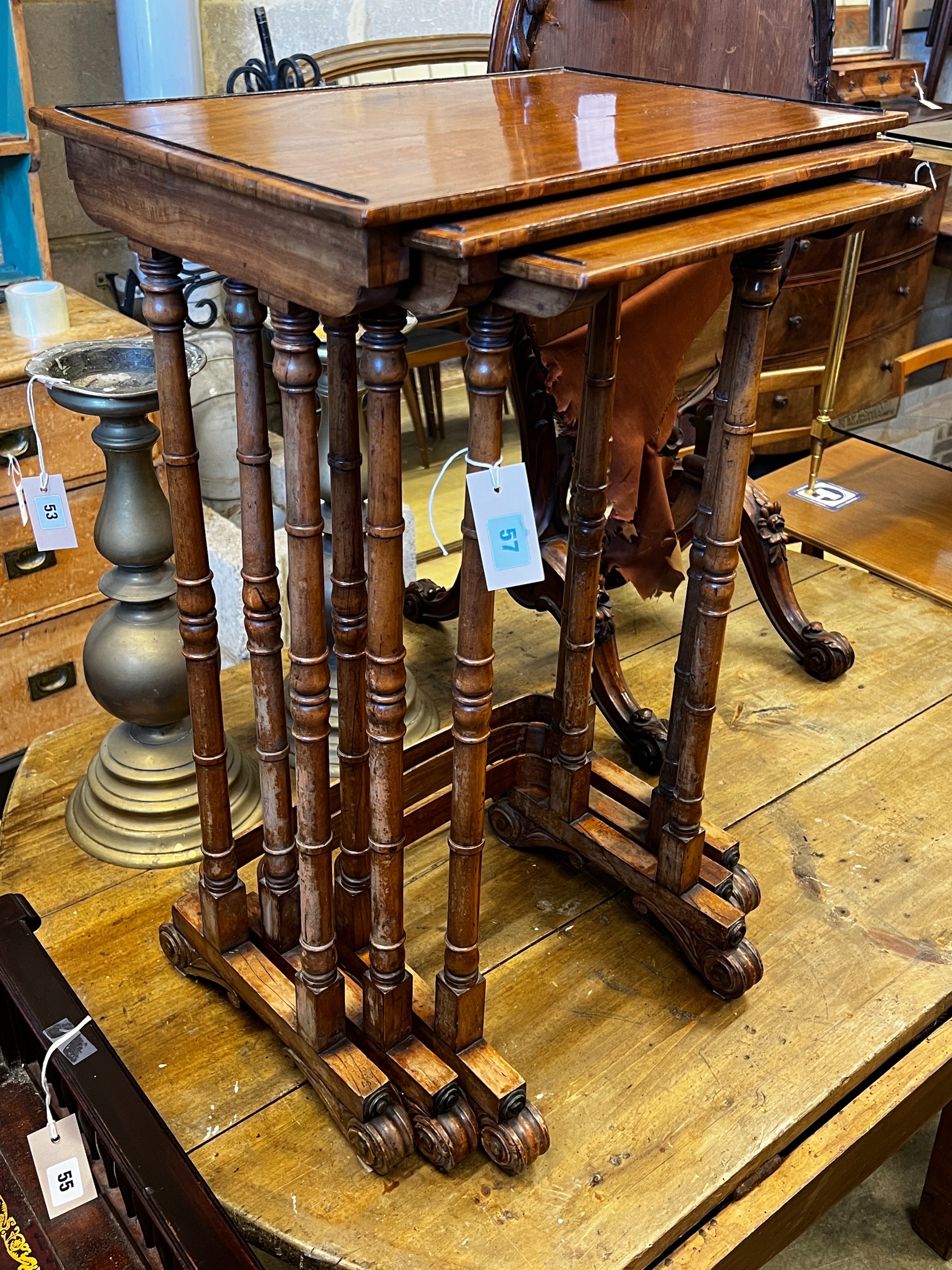 A nest of three William IV rectangular satinwood and mahogany tea tables, width 48cm, depth 33cm, height 73cm